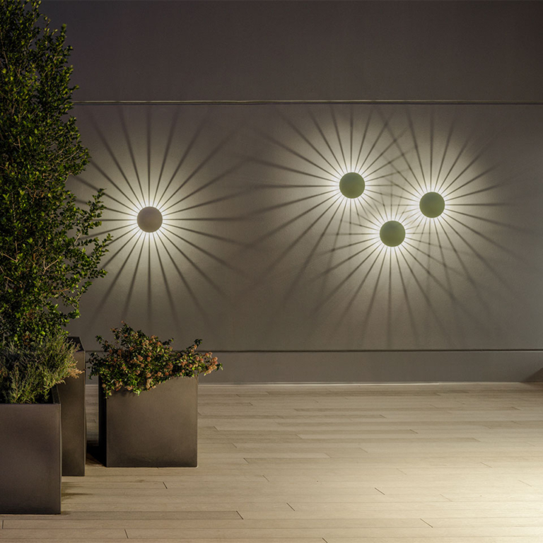 Lighting the vertical surfaces of outdoor settings 